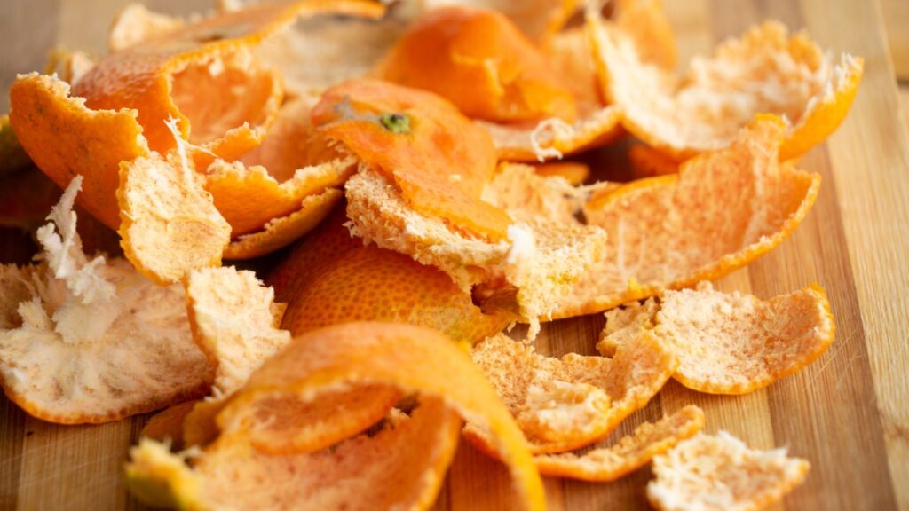 Pile of orange peels sitting on table