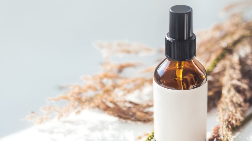 Amber spray bottle with label on table