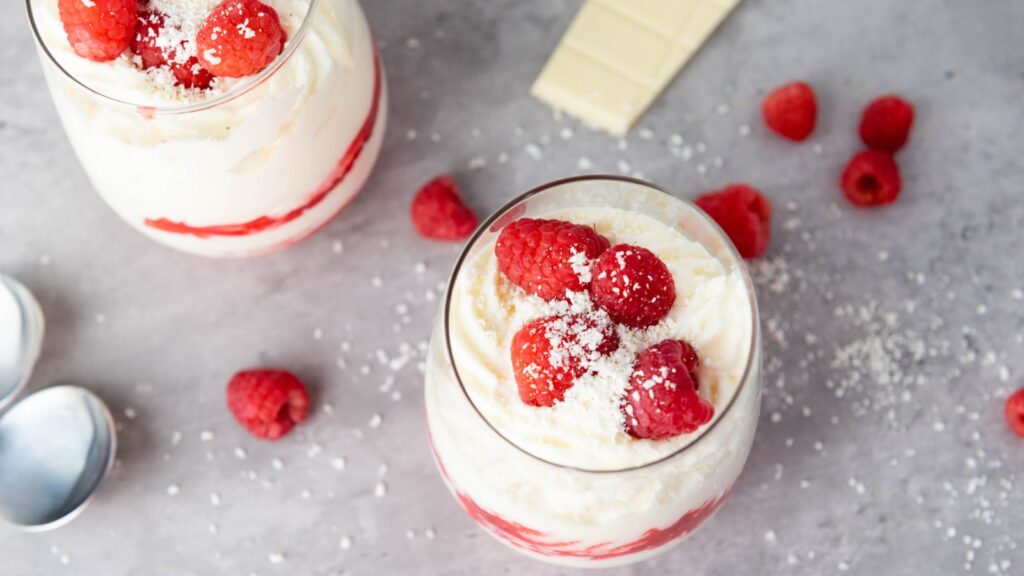 Glasses filled with raspberry white chocolate mousse