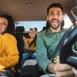 Family driving and laughing in the car