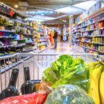 Shopping cart with healthy food and vegetables in it