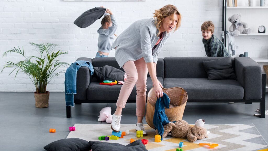 Mom trying to clean up while kids make a mess