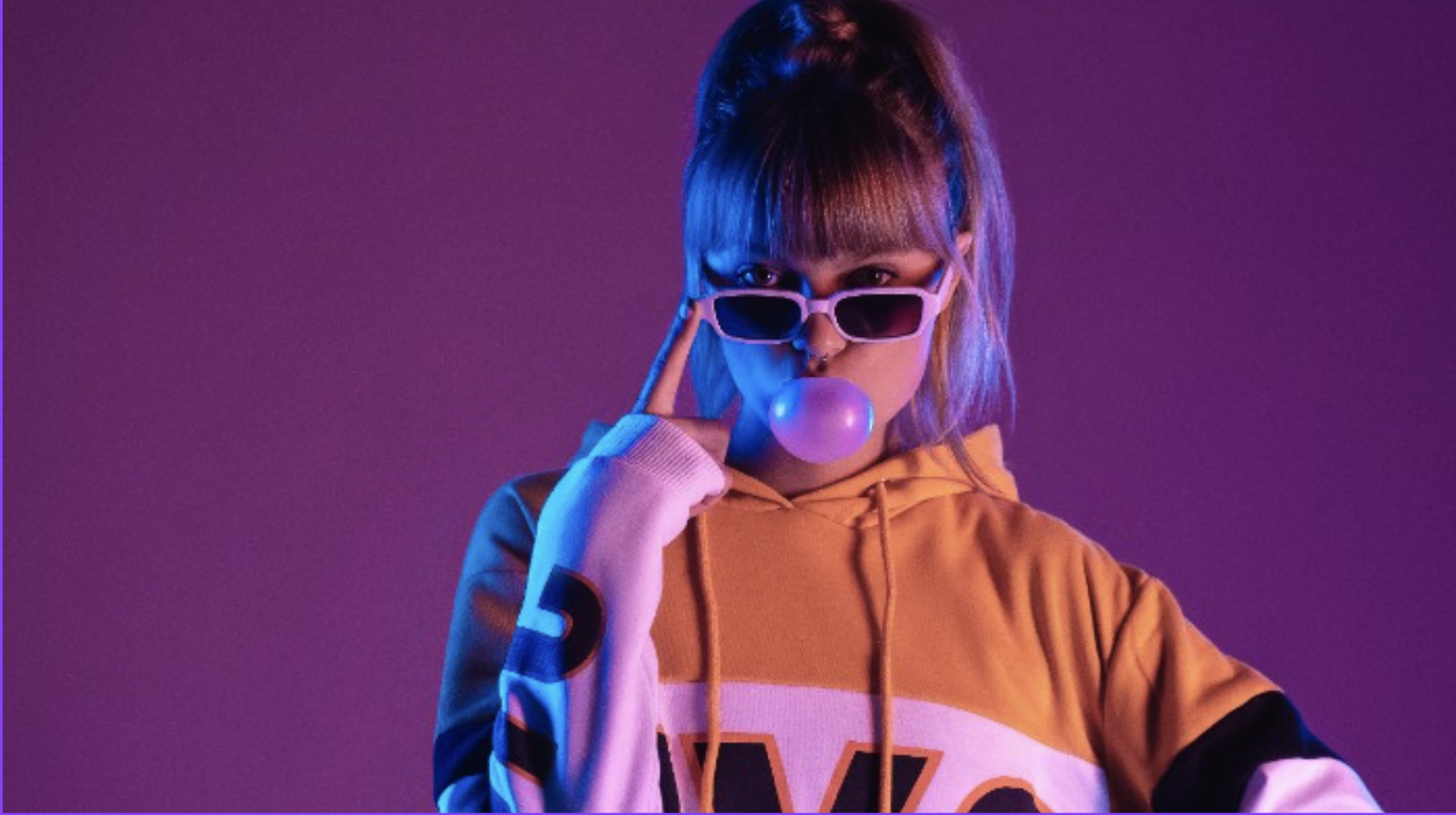 Teenage girl blowing a bubble