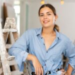 Woman leaning on a ladder