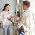 Couple seeming to argue and look upset