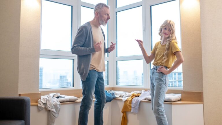 Dad and teenage daughter arguing