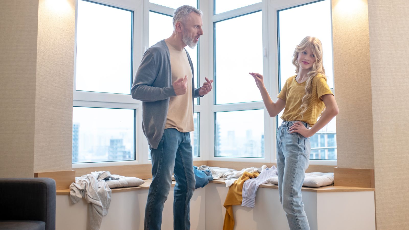 Dad and teenage daughter arguing