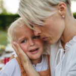 Mother trying to comfort a sad child