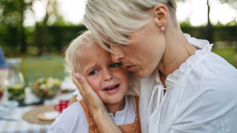 Mother trying to comfort a sad child