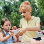 Mom looking worried with kids at a playground