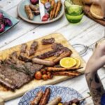 BBQ spread outside on a picnic table