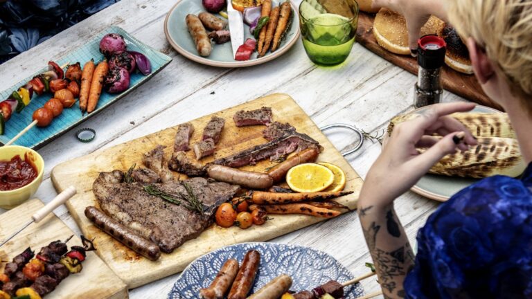 BBQ spread outside on a picnic table