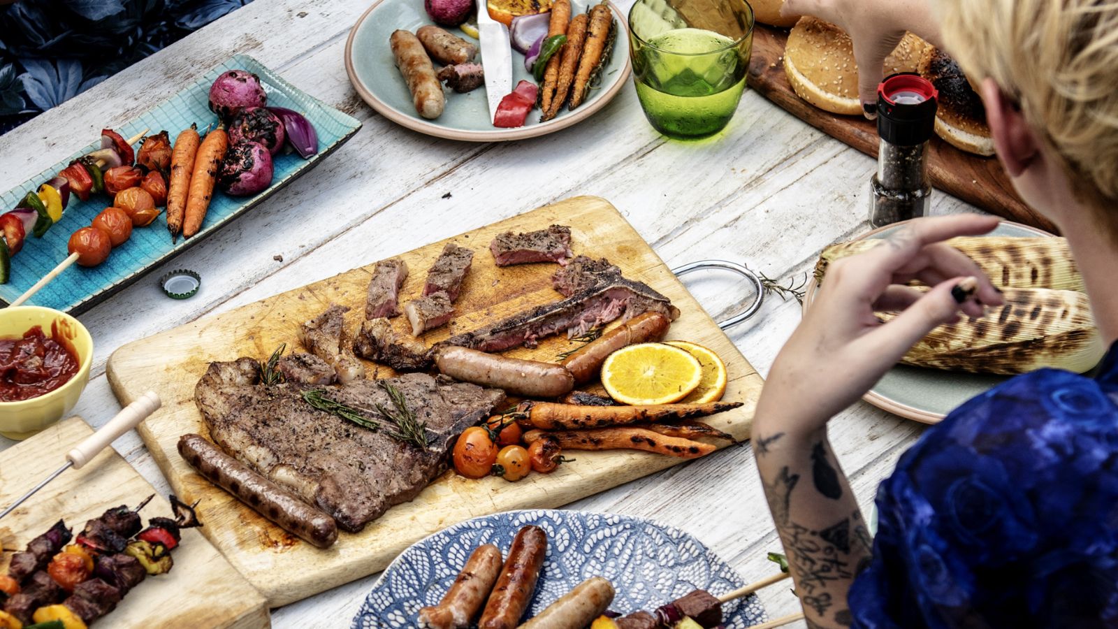BBQ spread outside on a picnic table