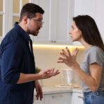 Married couple arguing in the kitchen