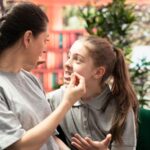 Teenagers fighting on the couch