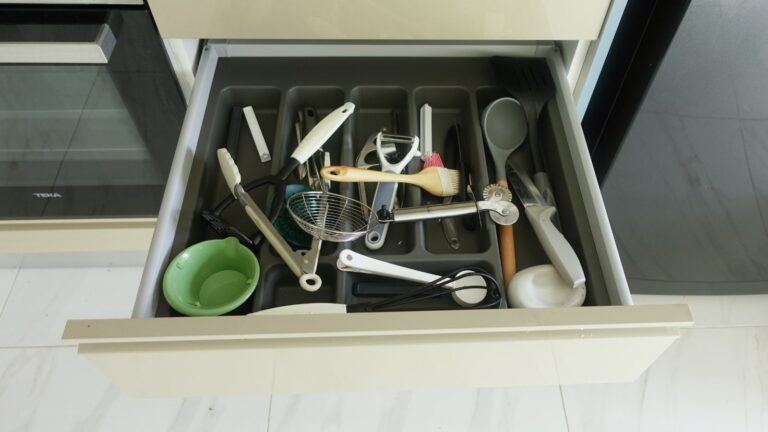 Messy open drawer in a kitchen