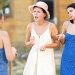 Mother arguing with her two daughters outside