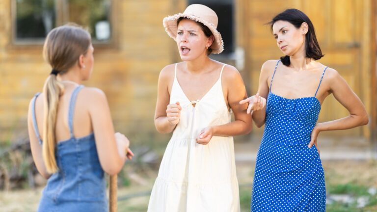 Mother arguing with her two daughters outside