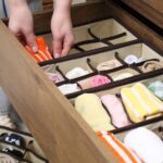 Woman organizing a dresser drawer