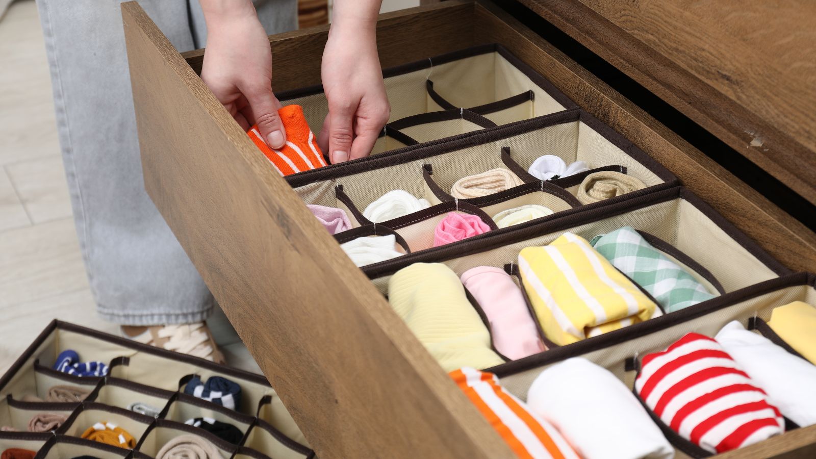 Woman organizing a dresser drawer