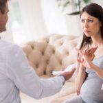 Man and pregnant woman arguing