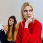 Two women looking like they're not getting along