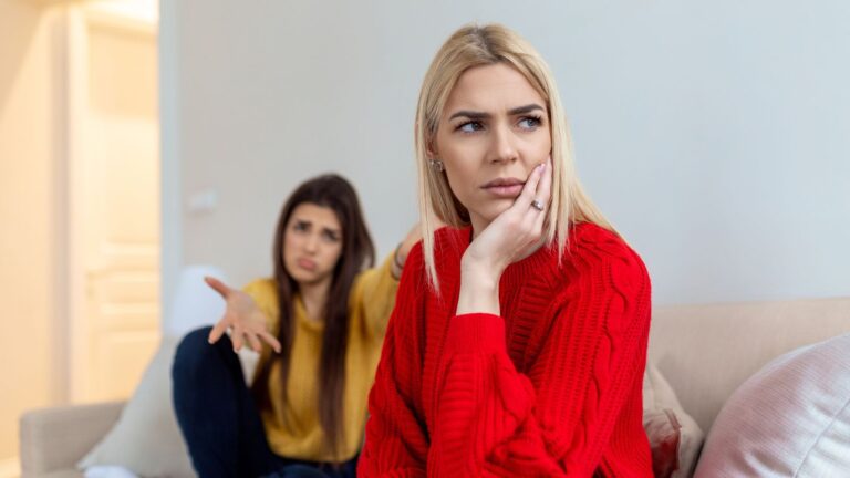 Two women looking like they're not getting along