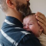 Dad holding a baby