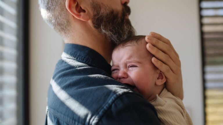 Dad holding a baby