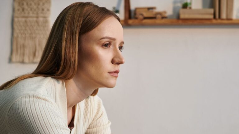 Woman looking upset staring