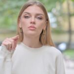 Woman standing outside looking mad