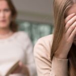 Mother angry at daughter who looks upset