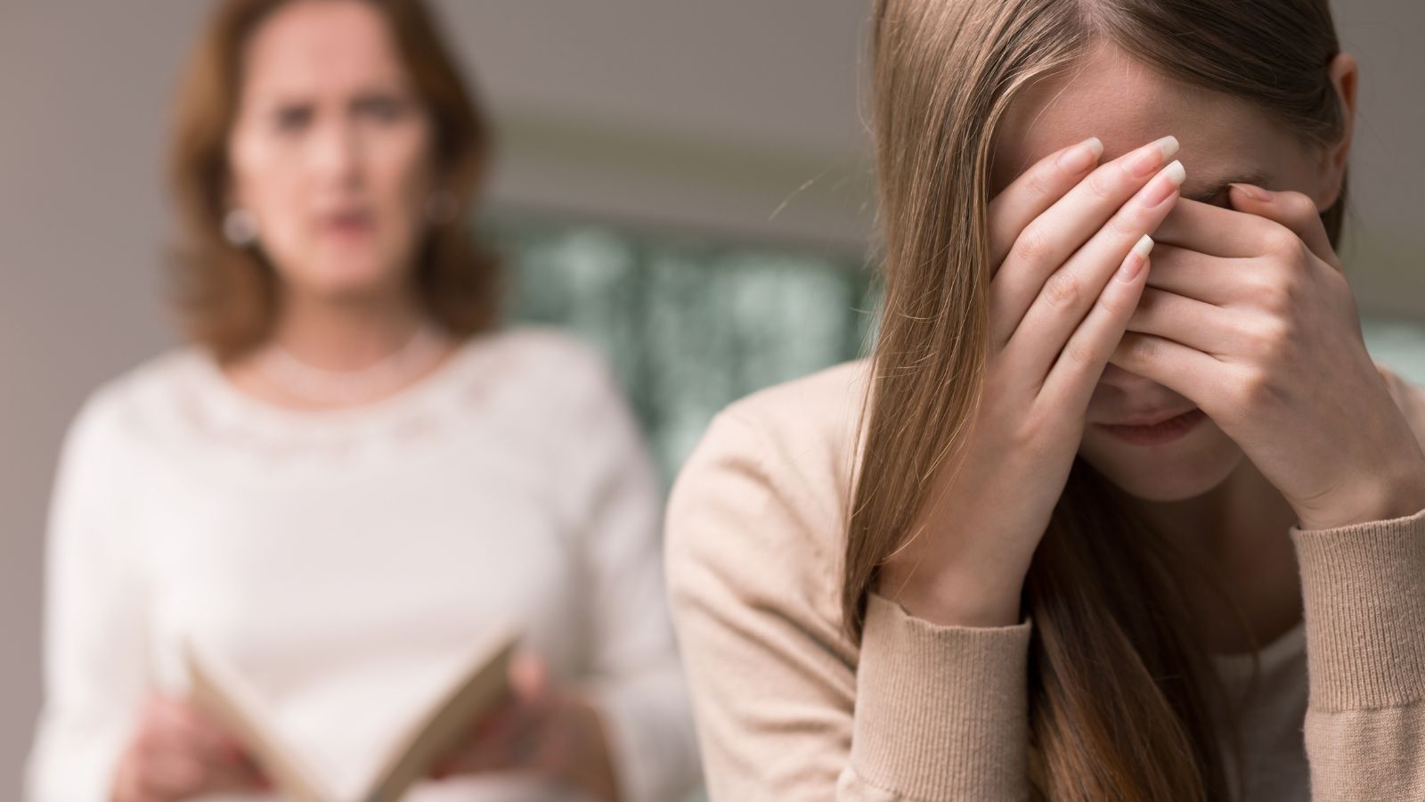 Mother angry at daughter who looks upset