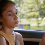 Young woman looking upset while on her phone