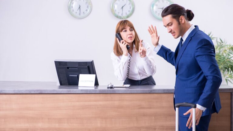 Businessman angry with hotel clerk