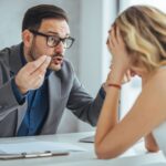 Male boss upsetting female employee