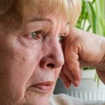 Older woman looking very upset