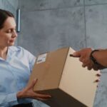Man delivering a package to a woman