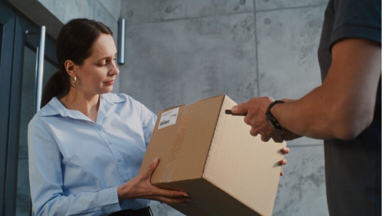 Man delivering a package to a woman