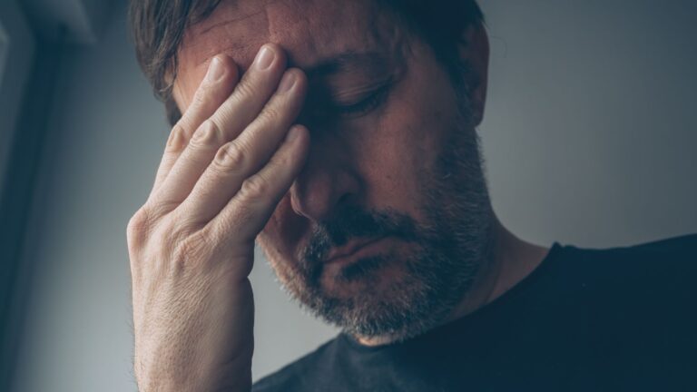 Middle-aged man looking very stressed
