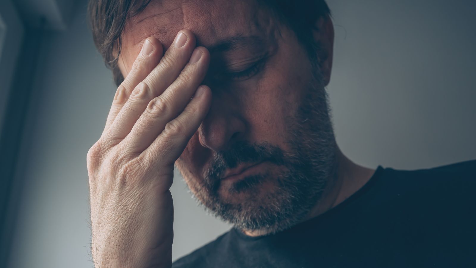 Middle-aged man looking very stressed