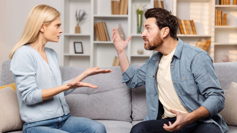 Adult siblings arguing on the couch