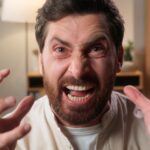 Angry man with his hands up in frustration