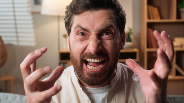 Angry man with his hands up in frustration