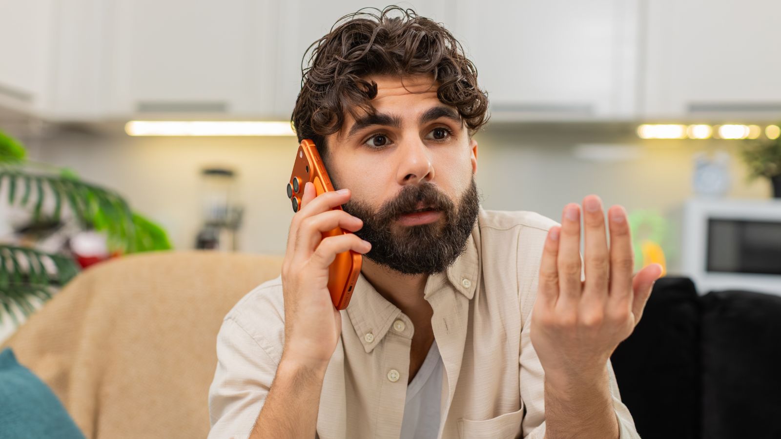 Man talking on the phone and looking very annoyed