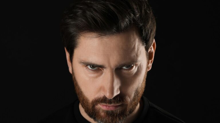 Angry looking man all in black