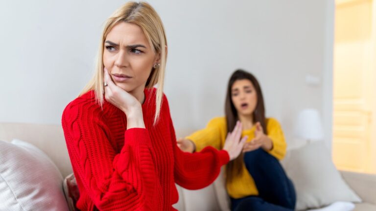 Women sitting on the couch arguing