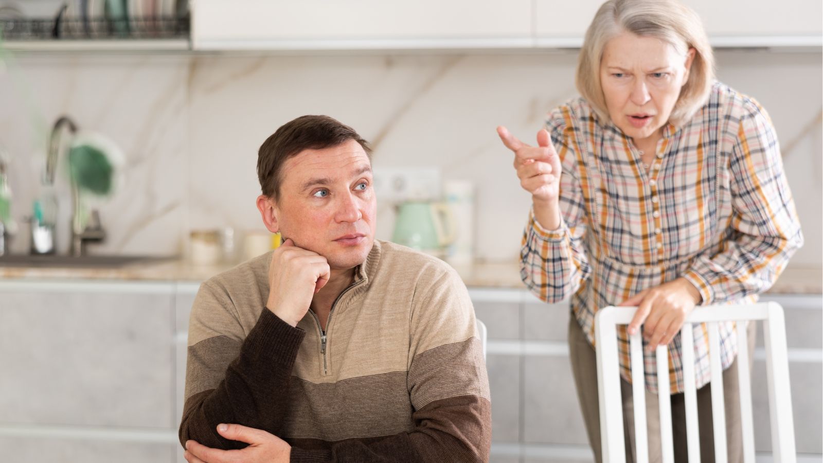 Mother chastising adult son