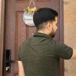 Man ringing doorbell