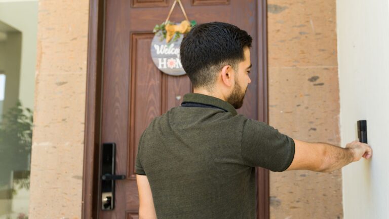Man ringing doorbell